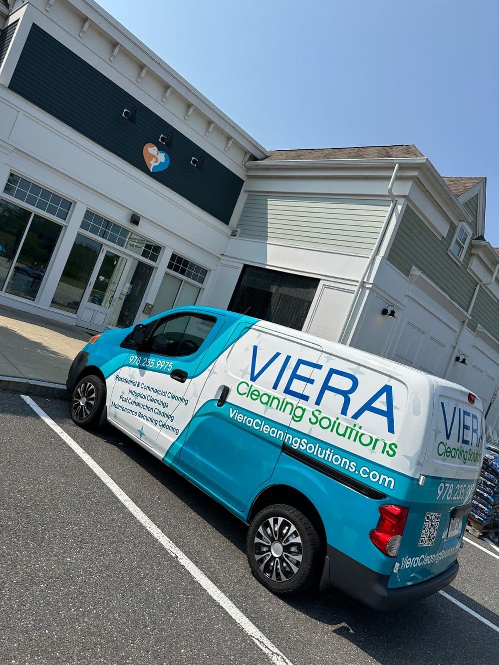 Viera Cleaning Solutions branded service van parked at a commercial property in Worcester County, MA